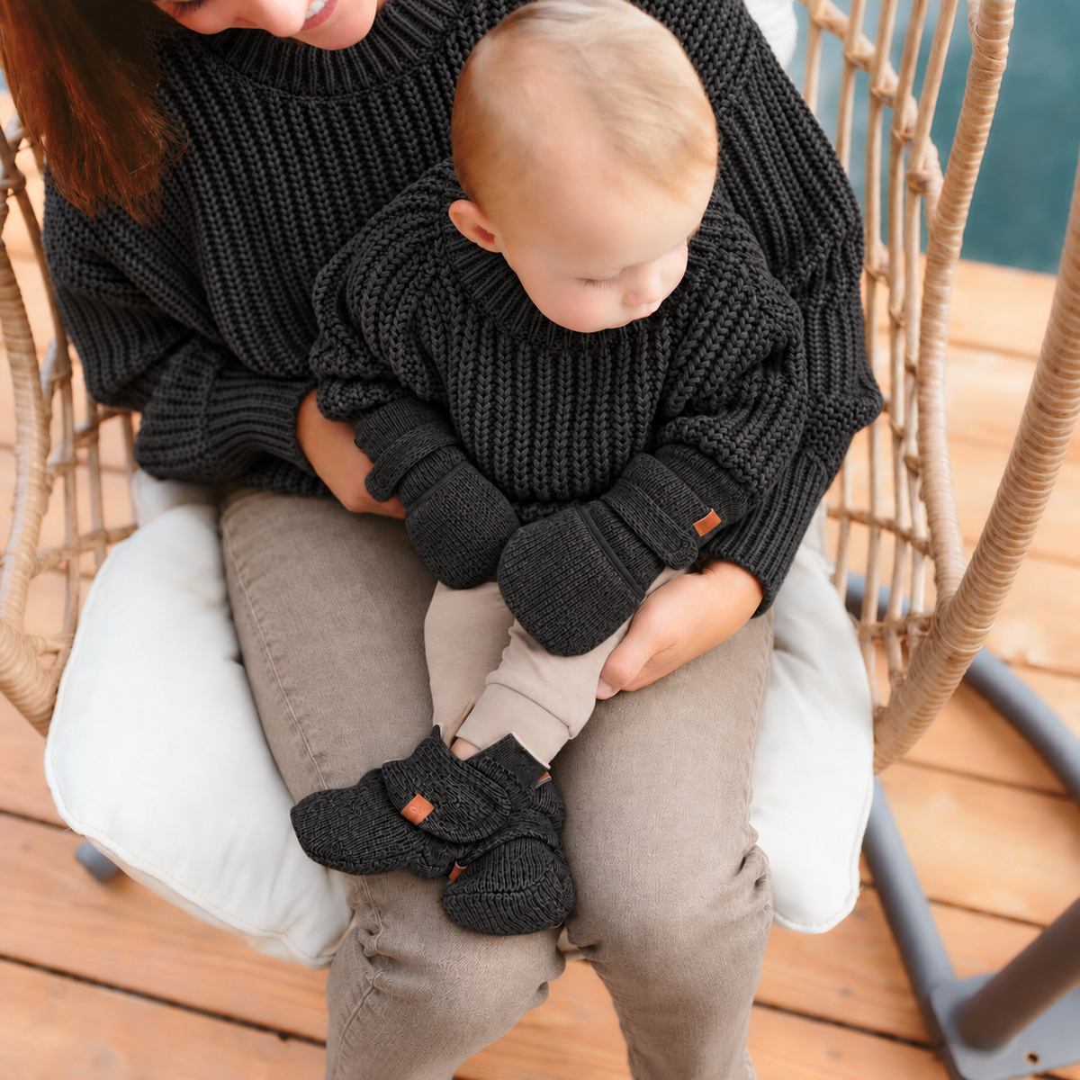 Matching stay-on baby boots and chunky knit sweater in shadow gray, styled together as a set