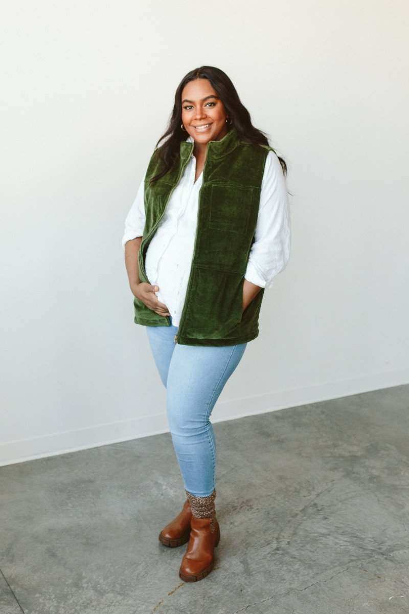 ADULT SHERPA/CORDUROY REVERSIBLE VEST in deep green corduroy, worn open over a white shirt with a textured collar
