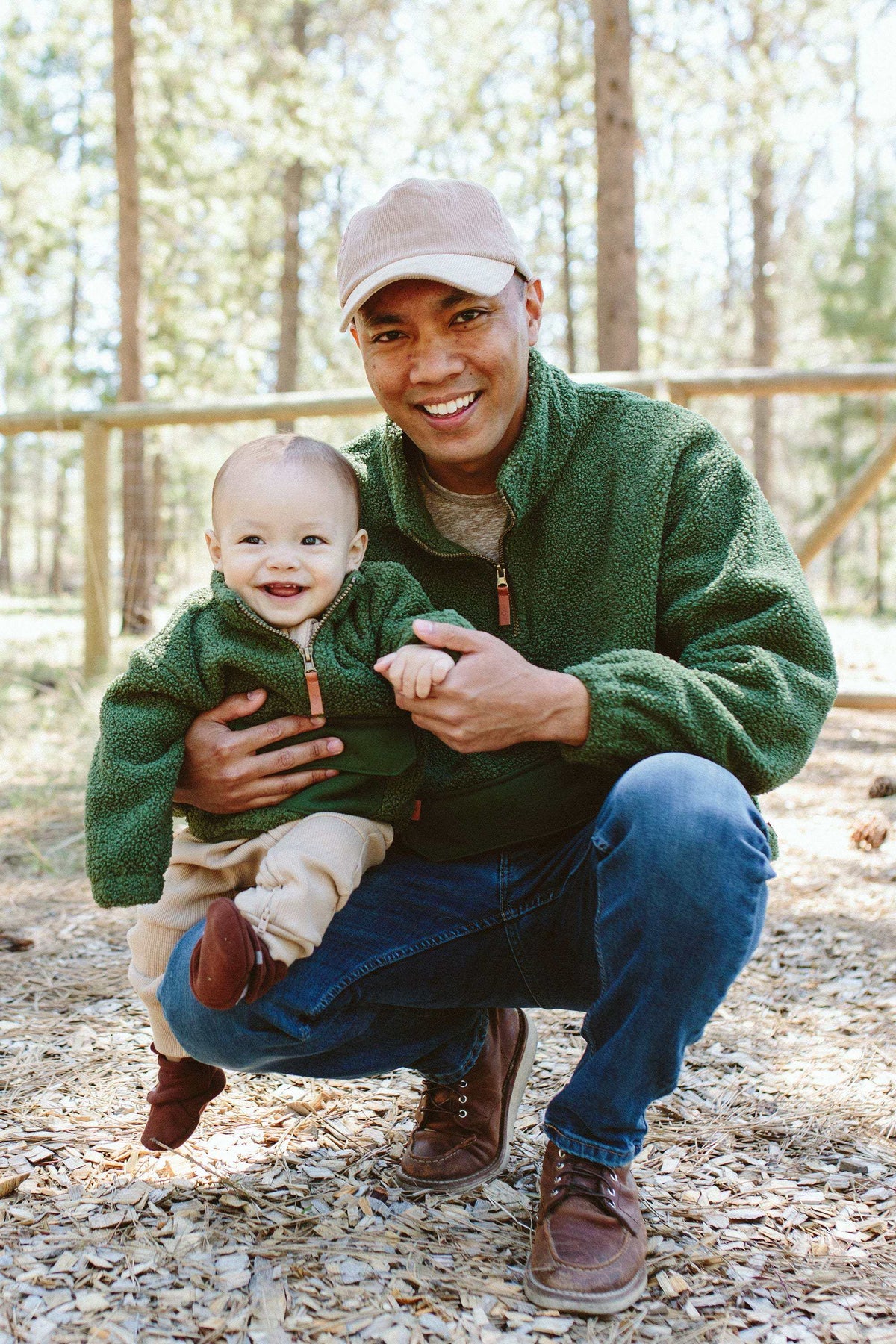 Adult Sherpa Zip Pullover in dark green plush sherpa fleece with a half zip and front pocket, worn by an adult