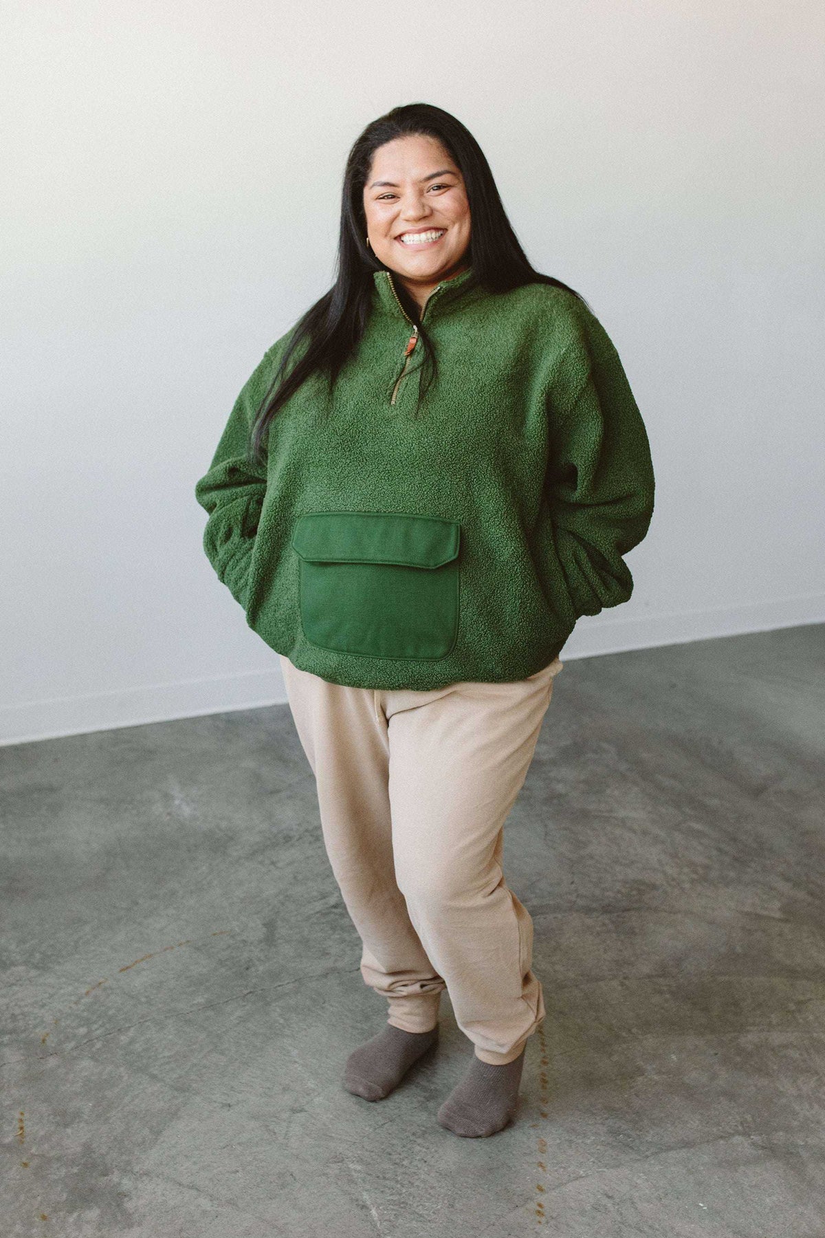 Adult Sherpa Zip Pullover in forest green plush sherpa, featuring a short zip neckline and large front flap pocket
