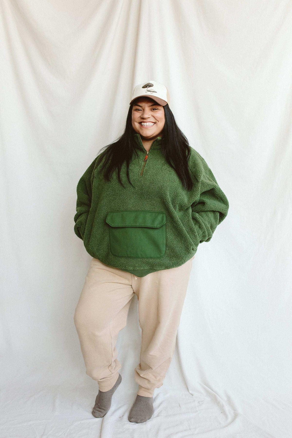 Adult Sherpa Zip Pullover in deep spruce green plush sherpa, with a short zip neckline and large front pouch pocket