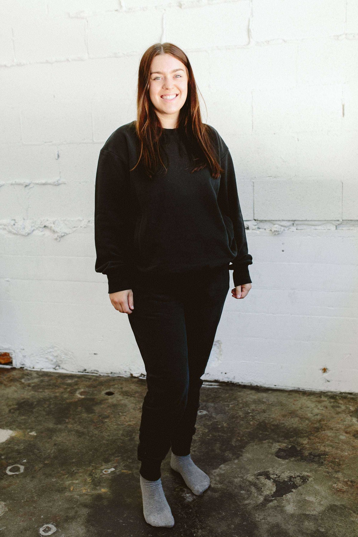 ADULT SWEATSUIT PANT in black, with a relaxed fit and soft-looking fabric, paired with a matching sweatshirt