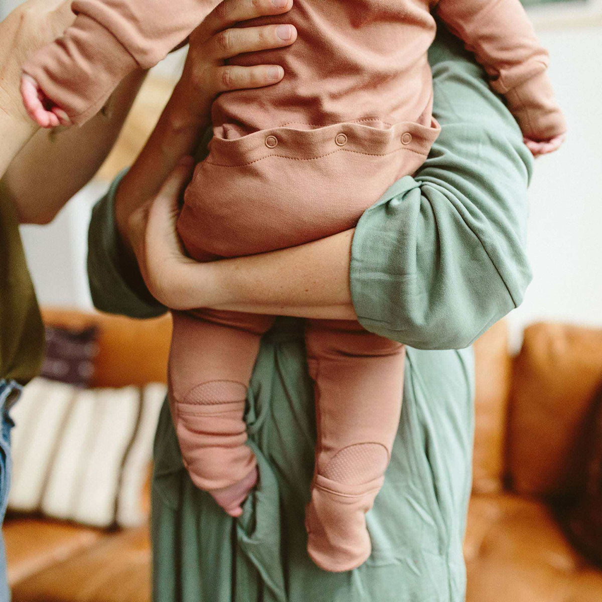 GROW WITH YOU FOOTIE in dusty rose, featuring a soft knit fabric, convertible cuffs and snap-button bum flap