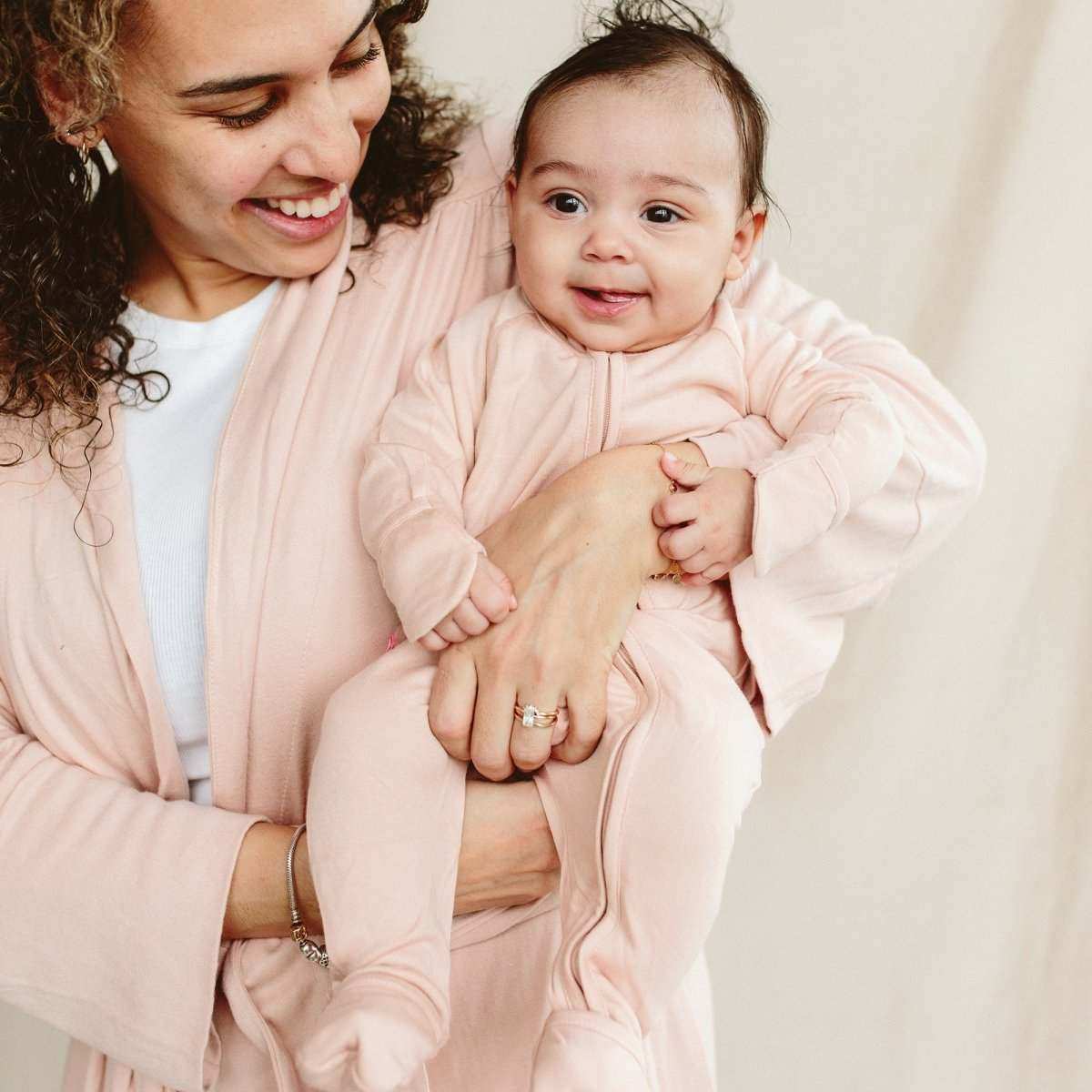 GROW WITH YOU FOOTIE in pale rose, a soft solid-colour baby sleeper with long sleeves and covered feet
