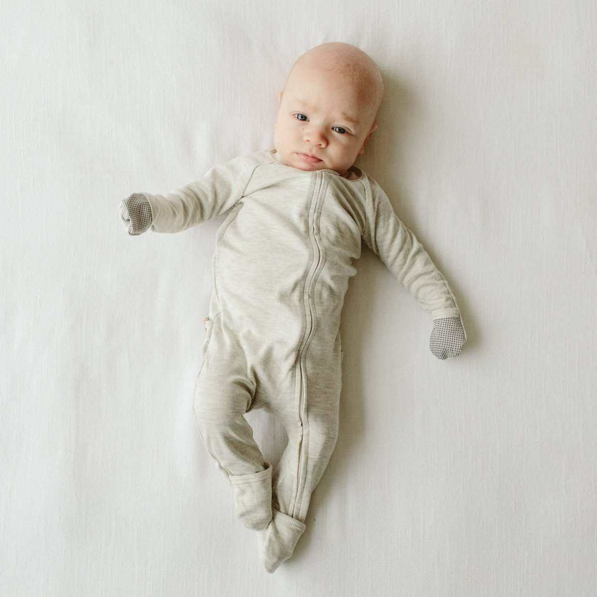 GROW WITH YOU FOOTIE in soft storm gray fabric with a full-length two-way zip and built-in mitts