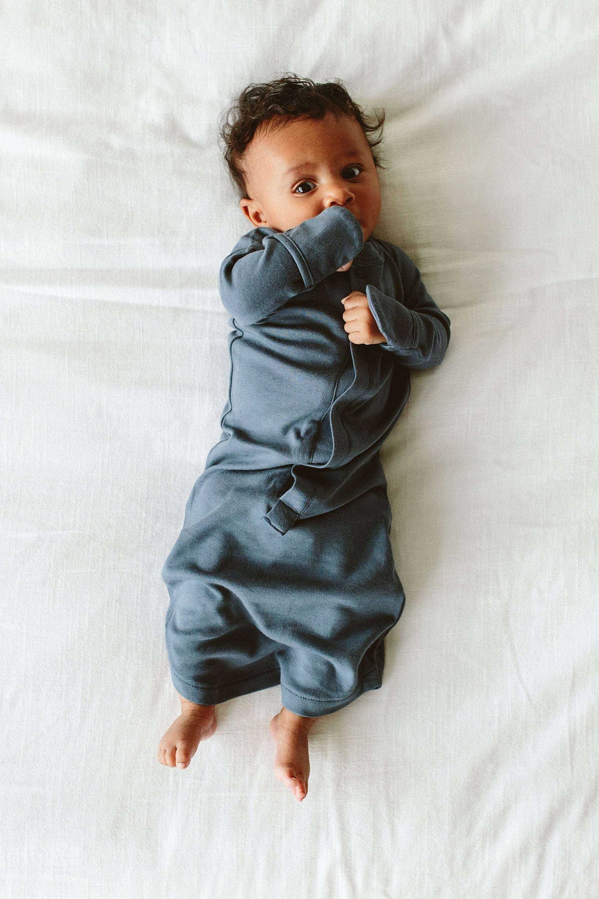 PREEMIE 24 HOUR CONVERTIBLE GOWN in midnight blue, with long sleeves, fold-over mitts, and a gathered convertible hem