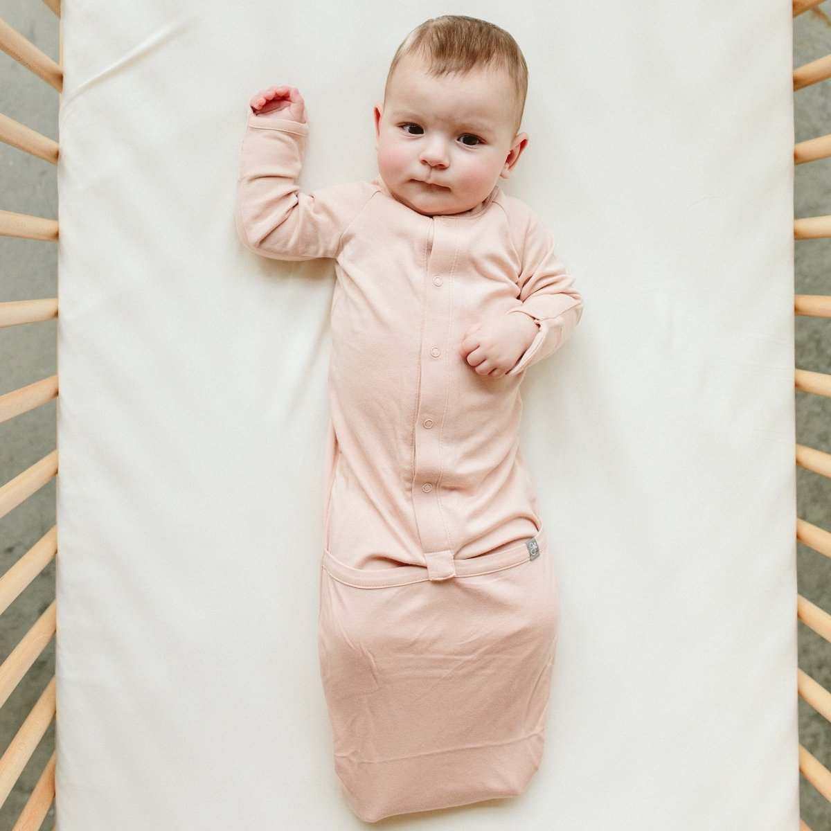 PREEMIE 24 HOUR CONVERTIBLE GOWN in soft rose pink, with long sleeves, front snaps and a convertible gathered hem