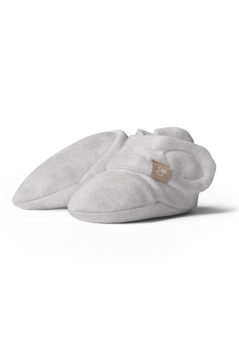 PREEMIE STAY ON BOOTS in light gray soft fabric, with rounded toes, cushioned soles, and adjustable wraparound closures.