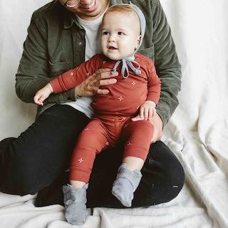 STAY ON 2-PACK MITTS featuring soft gray baby mitts with ribbed cuffs worn on an infant