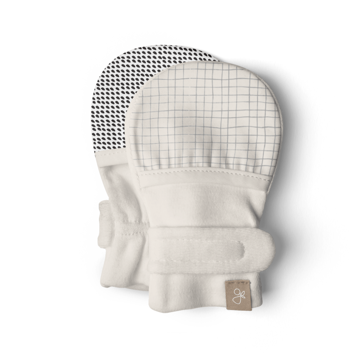 STAY ON 2-PACK MITTS in soft white fabric, with one fine gray grid print and one black dotted reversible pattern.