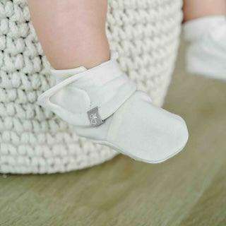 STAY ON BOOTS in pale birch, soft fabric with an adjustable wraparound strap and secure closure