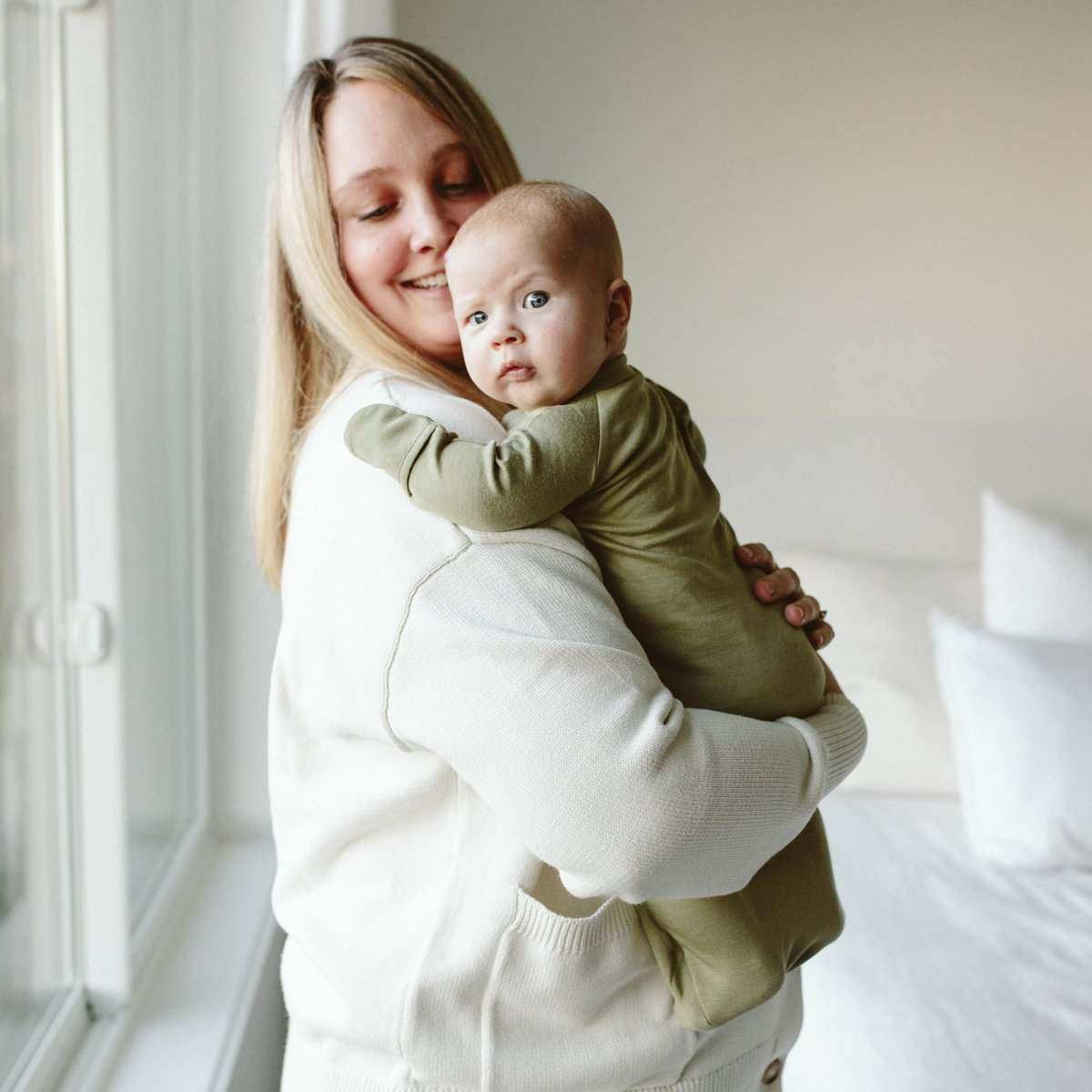 24 HOUR CONVERTIBLE GOWN in muted artichoke green, a soft solid-color baby sleeper with long sleeves and footed design