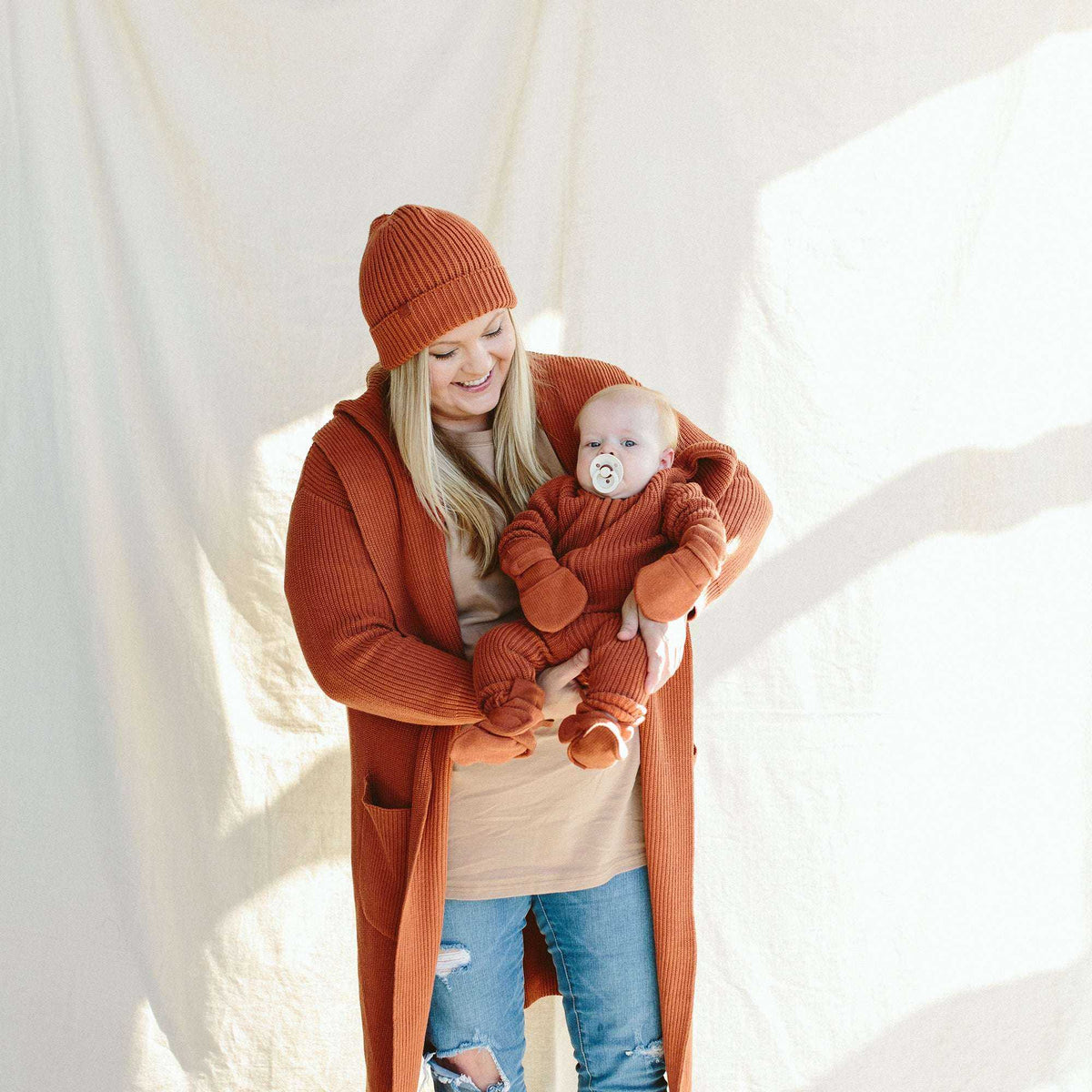 Knit Mitts in burnt orange ribbed knit, with soft cuffs and a matching warm look for a baby