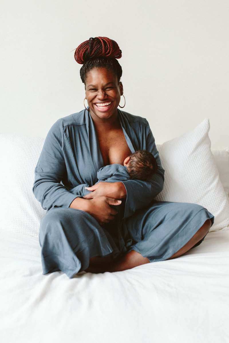 WOMENS ROBE in a solid slate blue-gray, soft draped fabric with three-quarter sleeves and a wrap front, worn while nursing a newborn
